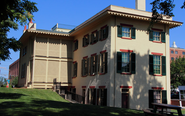 The Taft family house with several windows on three floors, under a deep blue sky The Taft family house with several windows on three floors, under a deep blue sky