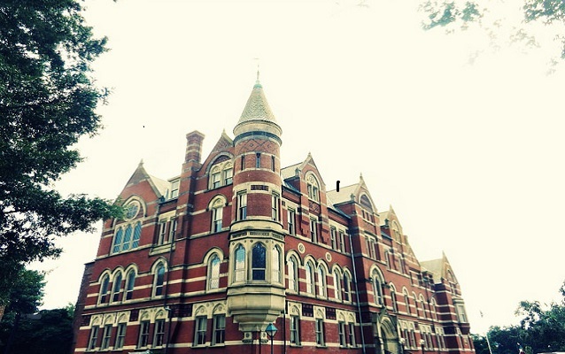 Exterior view of a red and yellow brick building.