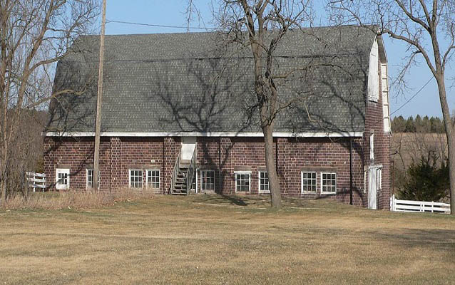 Exterior view of a brick barn-like building