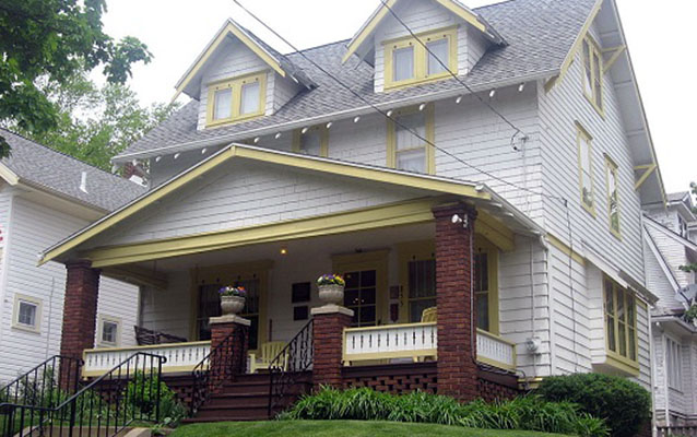 Exterior view of a residential home with wooden siding.