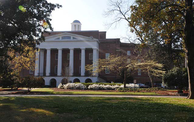 Exterior of a large building with columns.