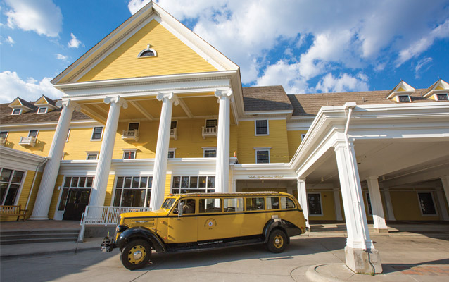 Yellow bus in front of Lake Hotel.
