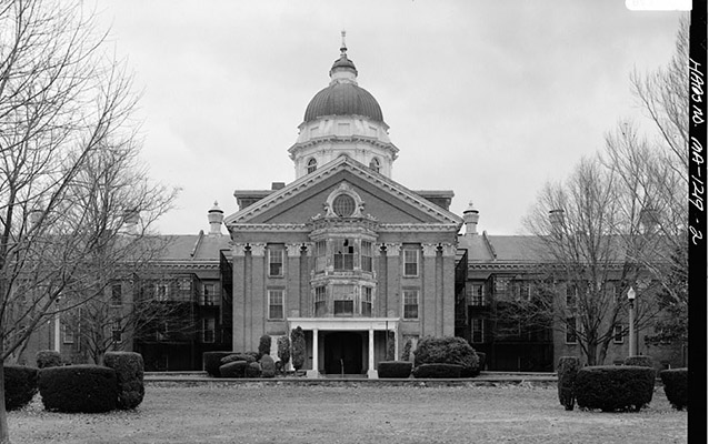 Exterior of a large building with a dome