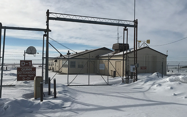 Snow on the ground at a closed, fenced compound Snow on the ground at a closed, fenced compound
