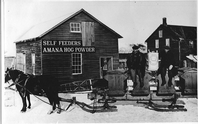 men and horses outside the powder house