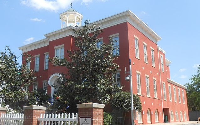 Brick school house with bell tower.