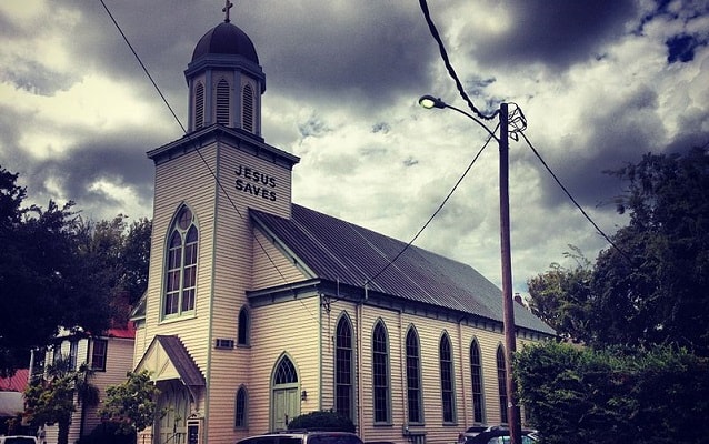 Carpenter Gothic style church with Gothic windows.