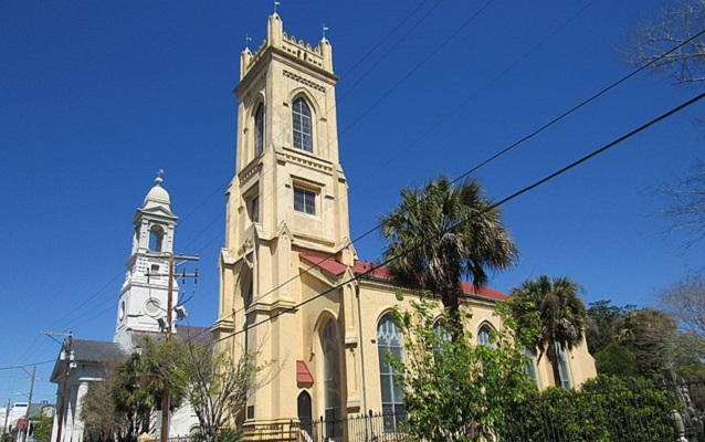 Photograph of Unitarian Church in foreground and St. John’s Lutheran Church in background. 