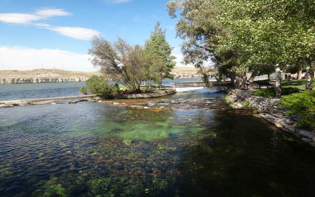 Green water with blue skies Green water with blue skies