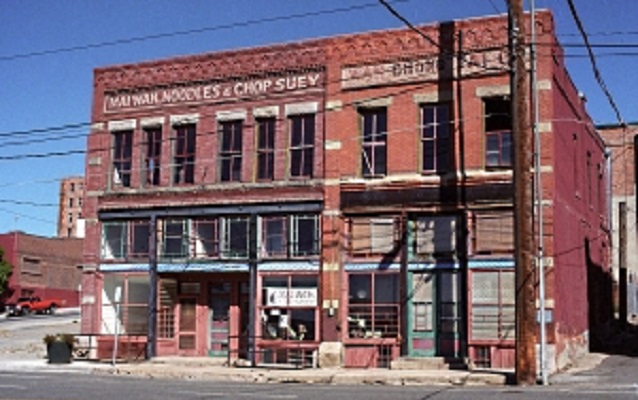 Two red-brick buildings. 