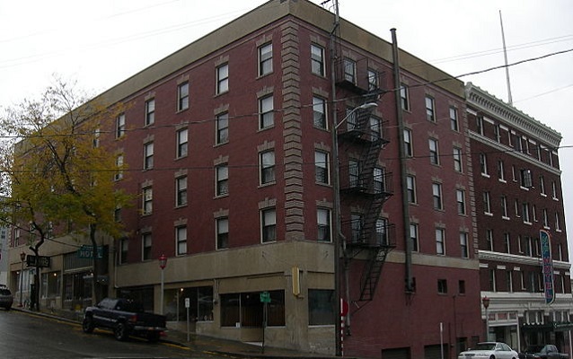 Contemporary photography of the hotel made of red brick.