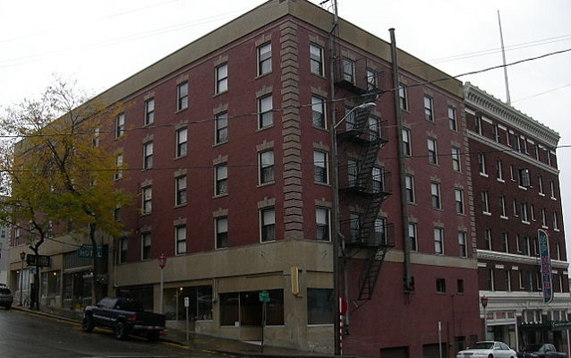 Contemporary photography of the hotel made of red brick. 