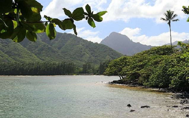 pond with mountains in background 