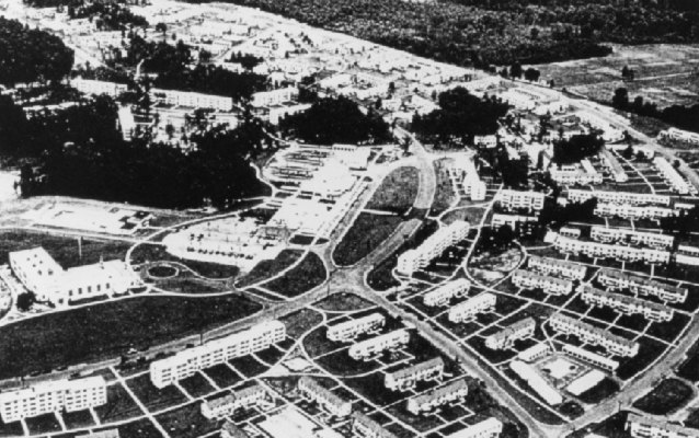 Black and white aerial photograph houses in crescent shape 