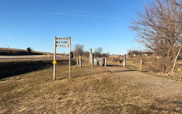 A bronze historical marker commemorates the route of a historic auto trail. A bronze historical marker commemorates the route of a historic auto trail.