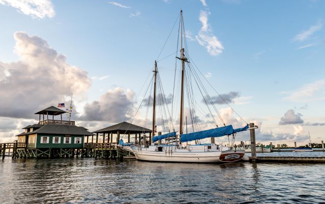 Docked sailboat during sunrise.