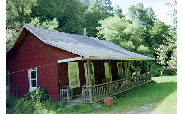front residence, one-story red house