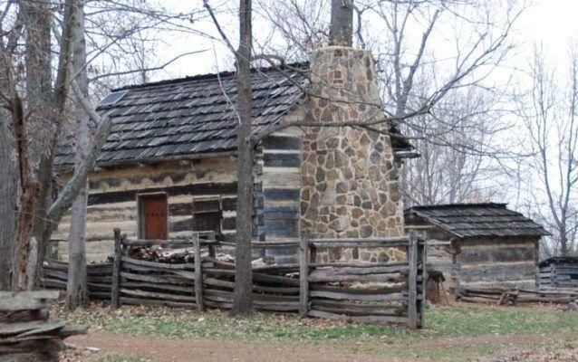 Photo of reconstructed log cabin and rail fencing. Photo of reconstructed log cabin and rail fencing.