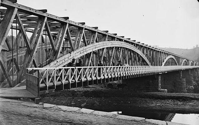 Historic photograph of men, during the Civil War, standing on the bridge at the canal Historic photograph of men, during the Civil War, standing on the bridge at the canal