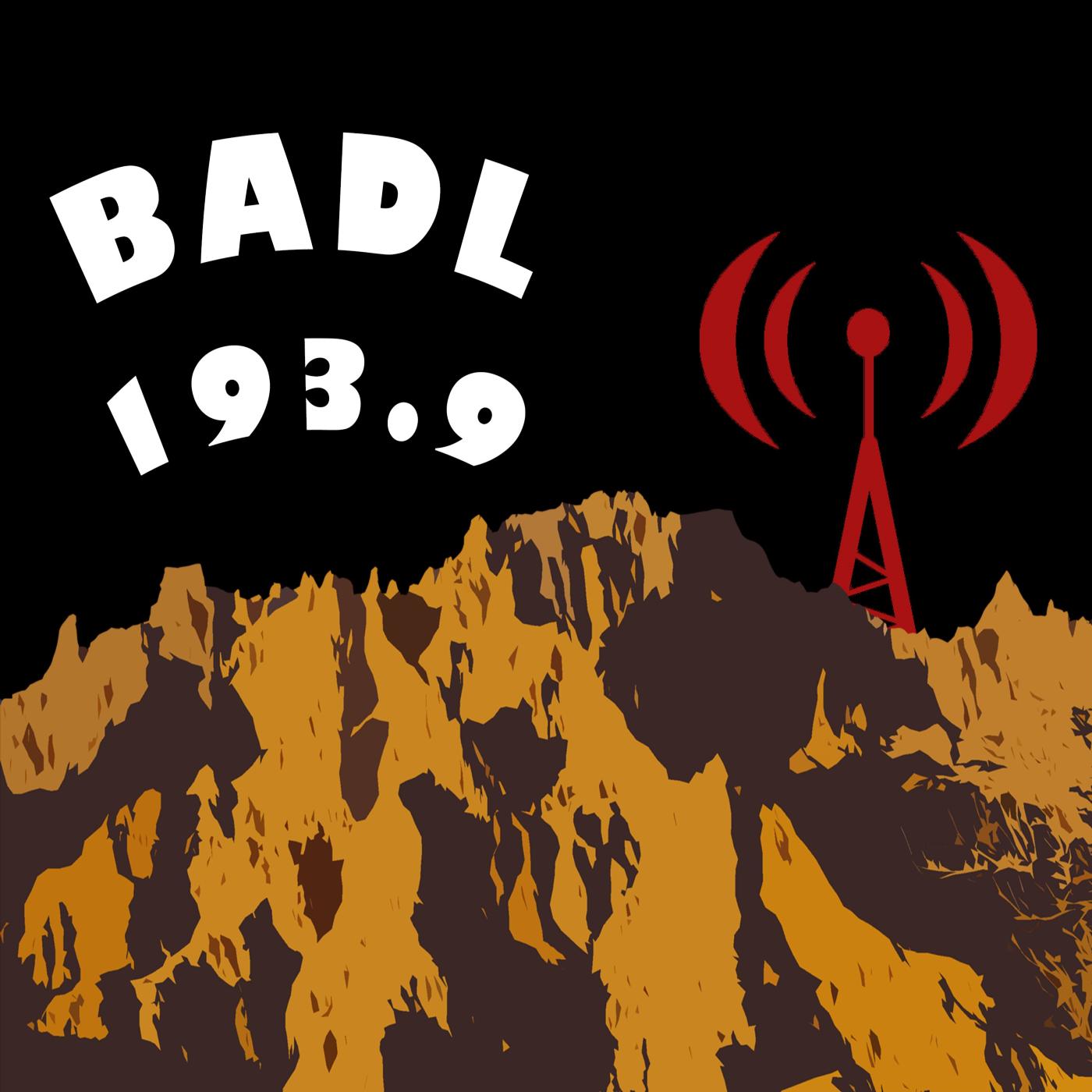 A stylized rendition of badlands formations with red radio tower and text BADL 193.9