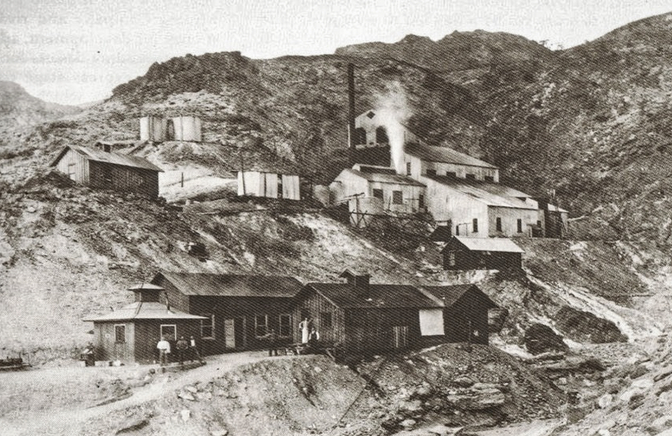 Photo of buildings on a desert mountain-side