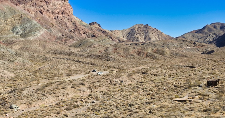 Old buildings in desert valley.