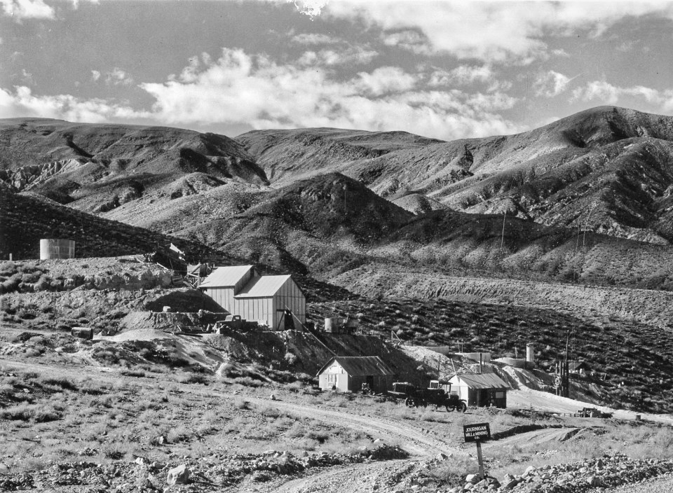 Buildings with desert mountains in background