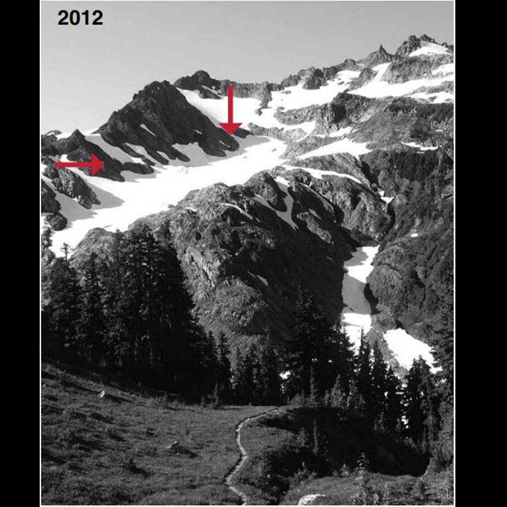 A large mountain glacier labeled 1980 with red arrows indicating its edges.