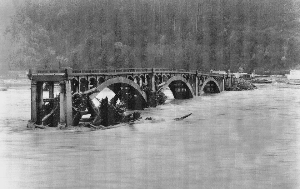 Collapsed bridge with debris in river