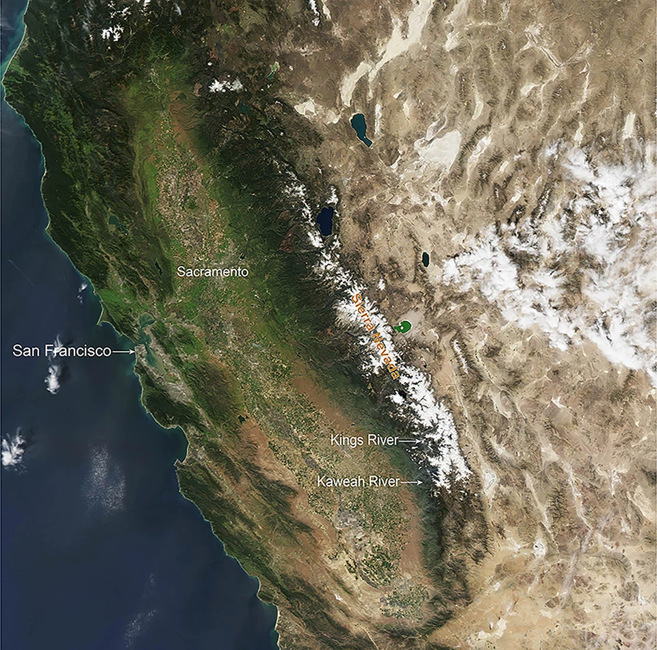 Aerial image shows view of an average year of snowpack (2010) in the Sierra Nevada, with snow covering middle to upper elevations across the Sierra Nevada.