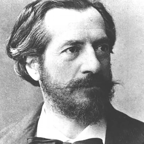 Black and white portrait of a man with wirey beard and moustache and necktie in a bow.