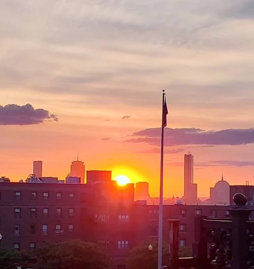 Sun sets over an urban landscape