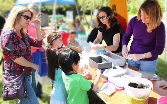 Families enjoying activities at Earth Day Birthday