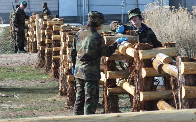 Cadets Applying Linseed Oil to Fence
