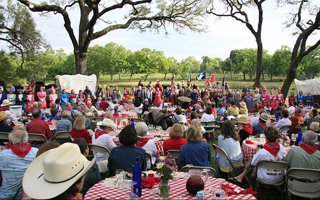 BBQ participants enjoy a western show