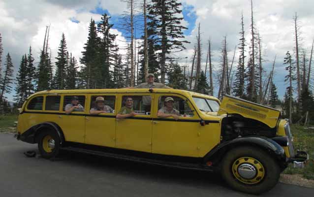Cedar Breaks' rangers and volunteers pose in a 1920's era tour bus during the Stories of the Past Festival