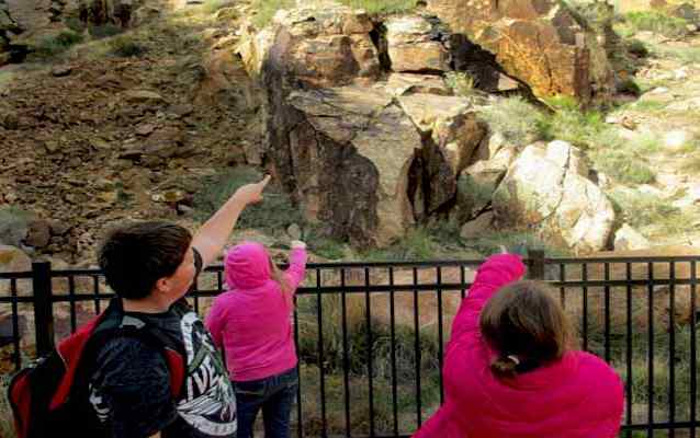 Master Junior Rangers from a local elementary school learn about petroglyphs.