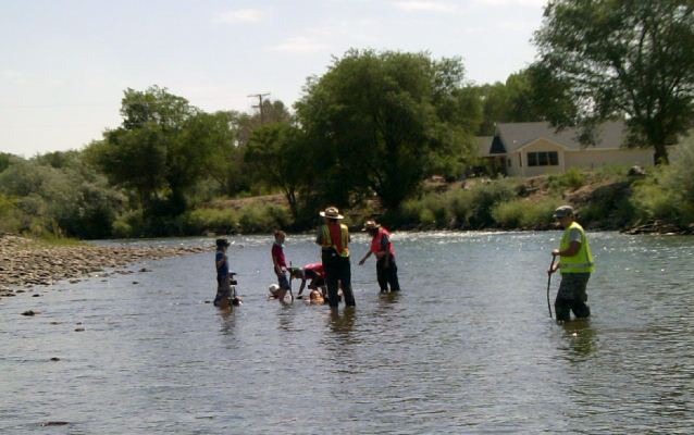 Children in river at approximate location of new pedestrian bridge