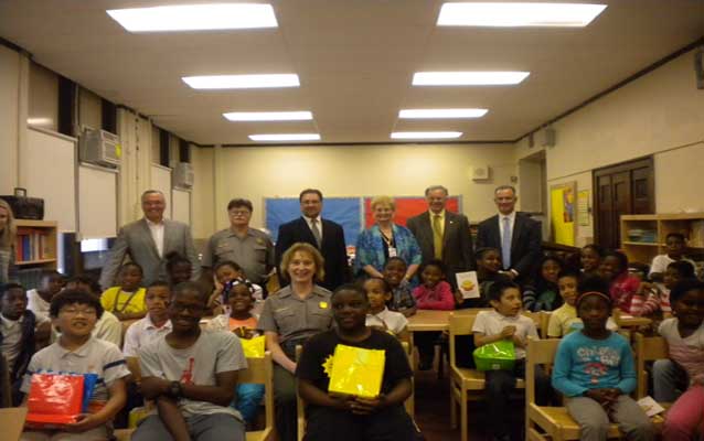 Students, park employees and representatives from Duffy Books pose for a group picture