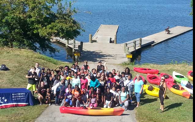 Mount Washington Middle School Students gather to celebrate a successful day on the water in Baltimore.