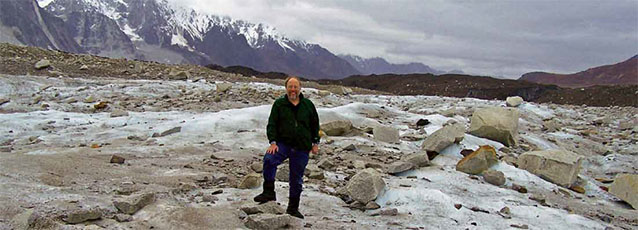 Bob Winfree stands in a field of rubble and ice Bob Winfree stands in a field of rubble and ice