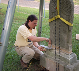 Using a tripod hoist to reset a marble headstone