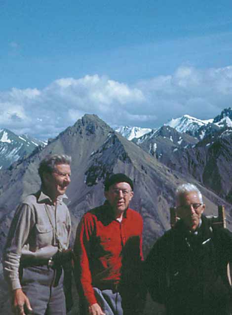 three old men standing on a mountain top three old men standing on a mountain top