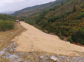 a wide, flattened dirt and gravel surface