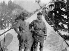 black and white image of two men standing side by side