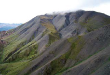 steep scree slope of a dark mountain