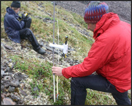 scientists on a mountainside