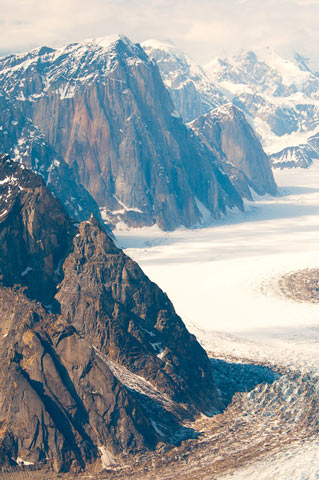 steep mountains overlooking a wide glacier