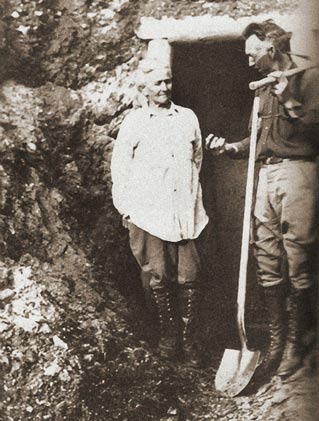 historic image of an old man and woman by a mine entrance historic image of an old man and woman by a mine entrance