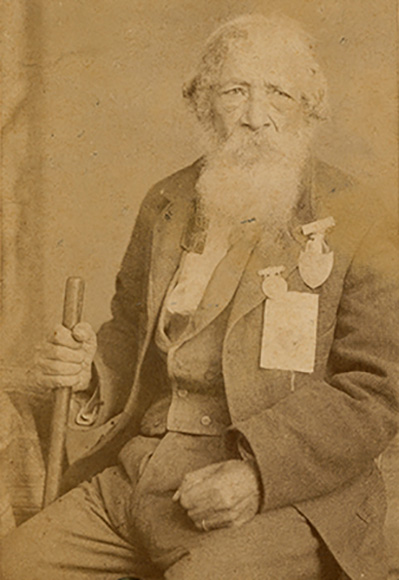 Photo of Jordan Noble: an elderly man white long white beard and medals decorating jacket